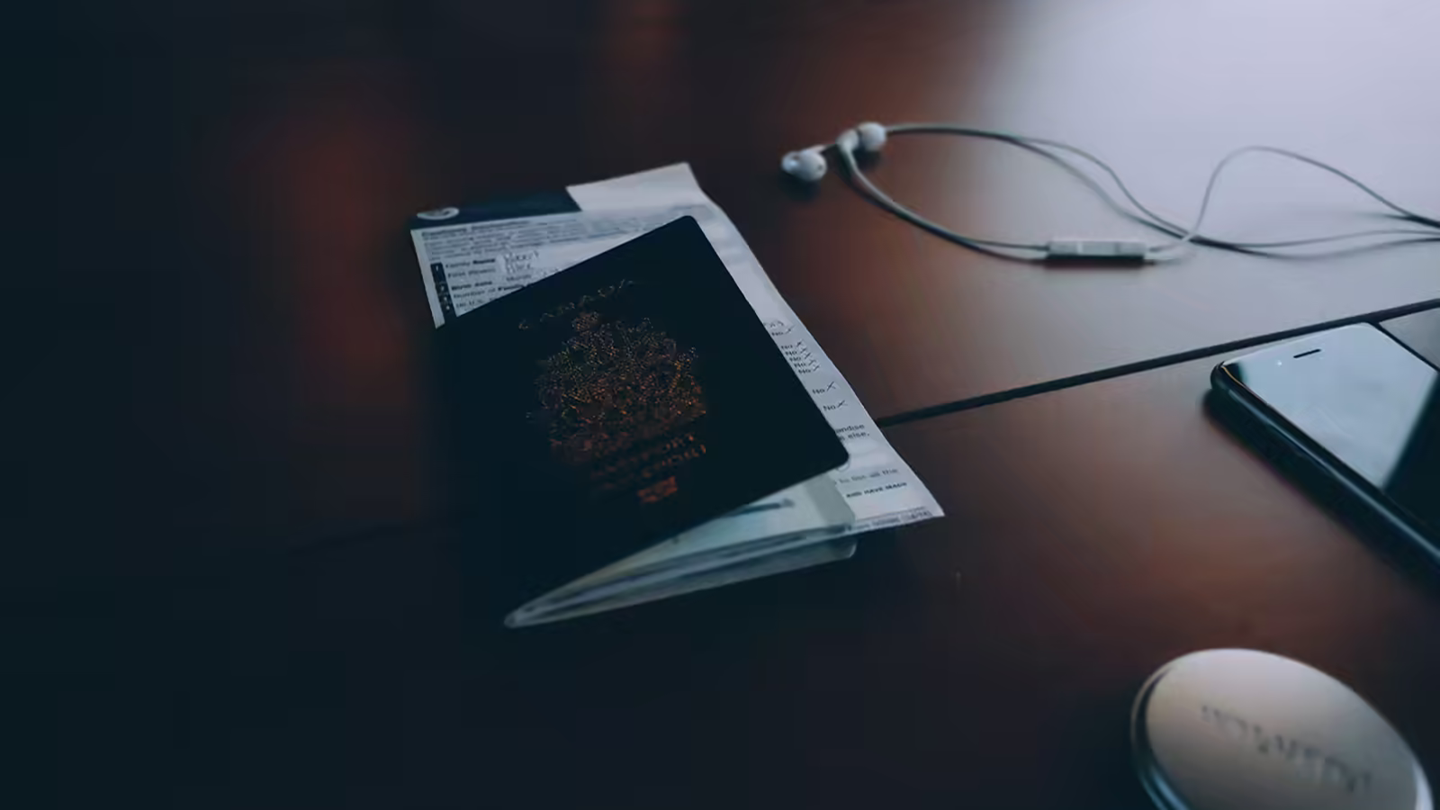 Bank-statement and paperwork flat-lay used here to illustrate the applicant-side evidence stack behind funds proof, itinerary, and return-home ties.